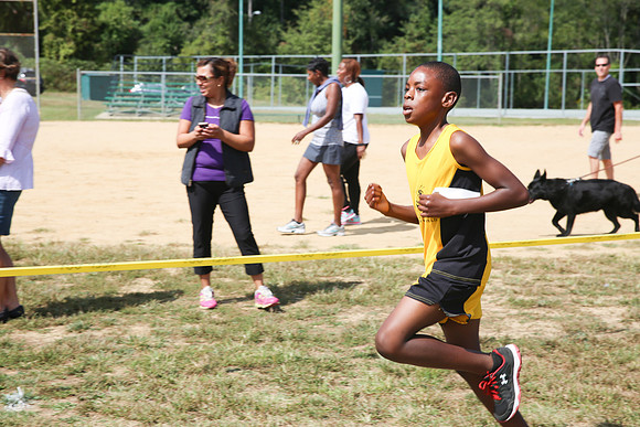 Finish strong Wesley Solomon - U12 Holy Name Cross Country Runner